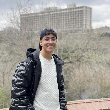 Moein Saharkhiz smiling outdoors